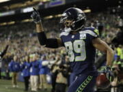 Seattle Seahawks wide receiver Doug Baldwin celebrates after catching a pass for a touchdown against the Green Bay Packers during the first half of an NFL football game Thursday, Nov. 15, 2018, in Seattle.