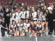 The Prairie High School volleyball team poses with the sixth-place trophy from the WIAA 3A state tournament at the Yakima SunDome on Saturday, Nov.