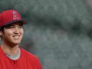 Los Angeles Angels’ Shohei Ohtani, of Japan, was voted American League Rookie of the Year after becoming the first player since Babe Ruth with 10 homers and four pitching wins in the same season. Ohtani, 24, received 25 first-place votes and four seconds for 137 points from the Baseball Writers’ Association of America in balloting announced Monday, Nov. 12, 2018. (AP Photo/David J.