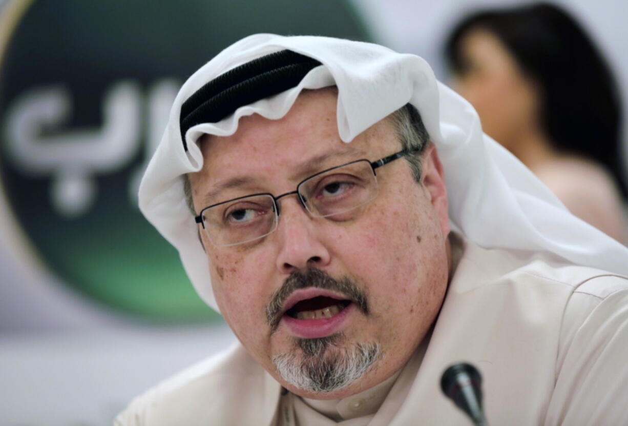 FILE - In this Dec. 15, 2014, file photo, Saudi journalist Jamal Khashoggi speaks during a press conference in Manama, Bahrain. President Donald Trump says the U.S. will not levy additional punitive measures at this time against Saudi Arabia over the killing of Jamal Khashoggi.