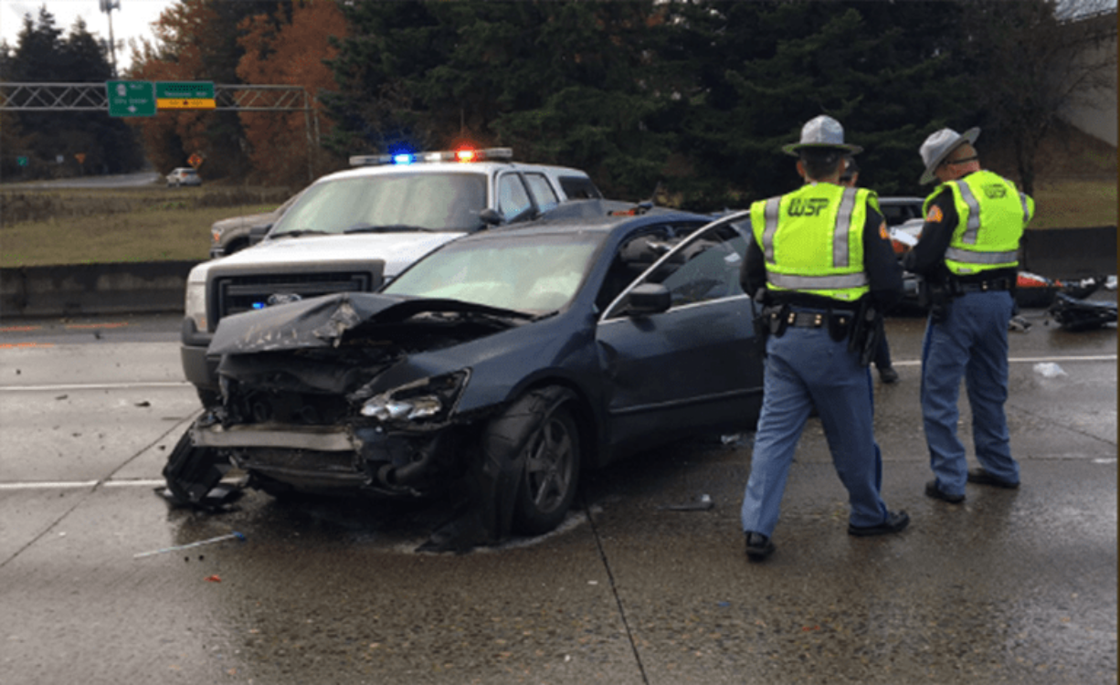 Troopers investigate a three-vehicle crash involving a trooper on a traffic stop.