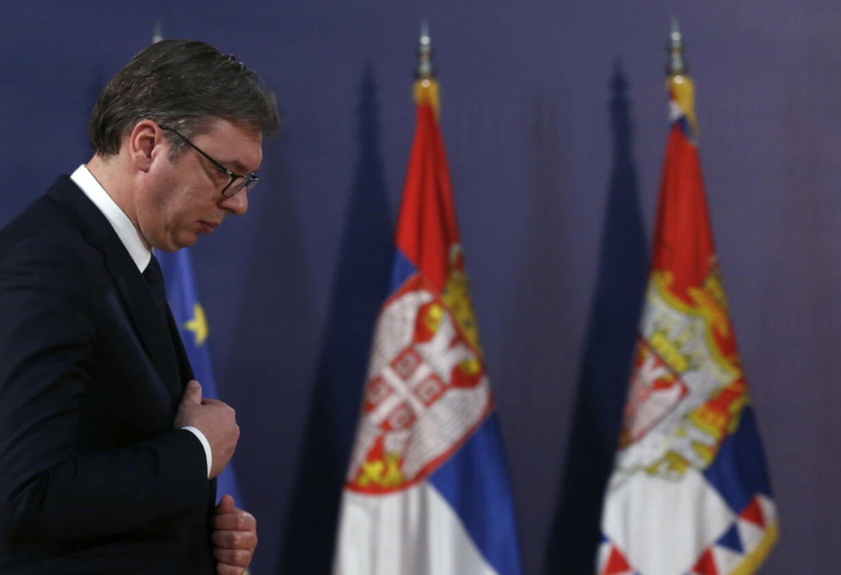 Serbian President Aleksandar Vucic arrives at a press conference Tuesday in Belgrade, Serbia. Serbia’s president has blasted the European Union and the West for allegedly failing to prevent Kosovo from triggering a trade war as tensions soar between the wartime foes.