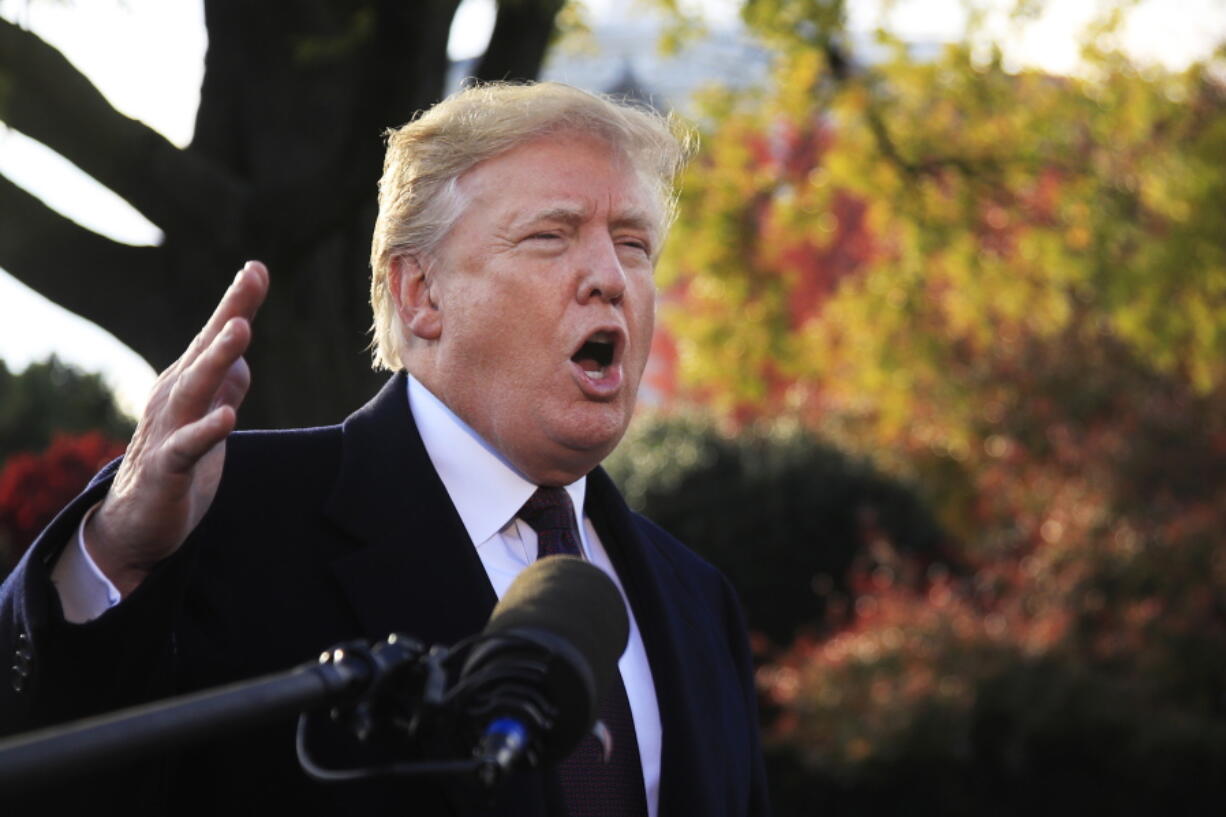 President Donald Trump speaks to the media before leaving the White House in Washington on Tuesday to travel to Florida, where he will spend Thanksgiving at Mar-a-Lago.