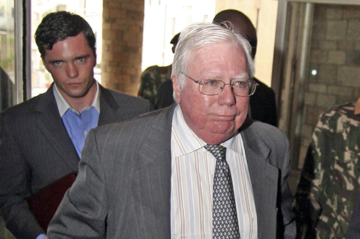 Jerome Corsi, right, arrives at the immigration department in Nairobi, Kenya. Special counsel Robert Mueller’s team believes a conservative author and conspiracy theorist tipped off Trump confidant Roger Stone months before WikiLeaks released thousands of emails stolen from Hillary Clinton’s campaign, according to a document made public Tuesday, Nov. 27, 2018. The document, which was drafted as part of a plea offer to Corsi, provides an unprecedented window into an active part of Mueller’s investigation into Russian election interference and possible coordination with Trump associates.