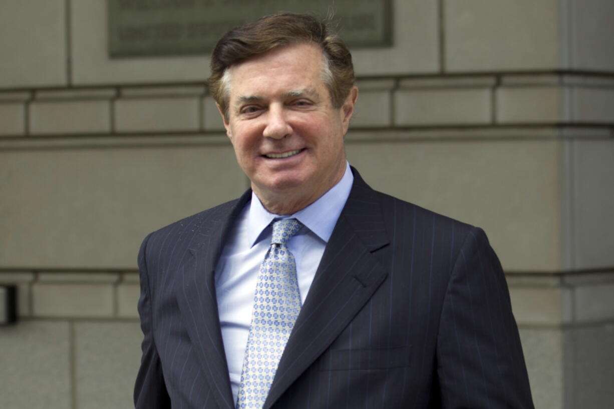 FILE - In this May 23, 2018, file photo, Paul Manafort, President Donald Trump’s former campaign chairman, leaves the Federal District Court after a hearing, in Washington. Manafort’s attorneys are heading to court Friday at a time of frenetic activity in the special counsel’s Russia investigation. Prosecutors this week obtained a guilty plea from President Donald Trump’s longtime fixer Michael Cohen and appear to be lining up charges against another Trump supporter.