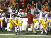 Southern California’ Aca’Cedric Ware (28) races past his bench on a 57-yard touchdown run in the first half of an NCAA college football game against Oregon State in Corvallis, Ore., on Saturday, Nov. 3, 2018. (AP Photo/Timothy J.