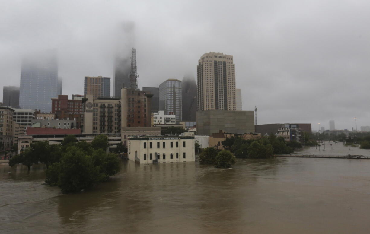 Floodwaters from Tropical Storm Harvey overflow from Buffalo Bayou on Aug. 28, 2017, in downtown Houston, Texas.