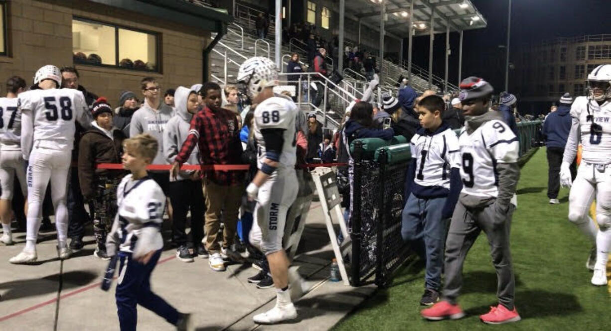 Skyview Storm players walk off the field at Pop Keeney Stadium after Saturday's 34-21 loss to Woodinville in the 4A state playoffs.