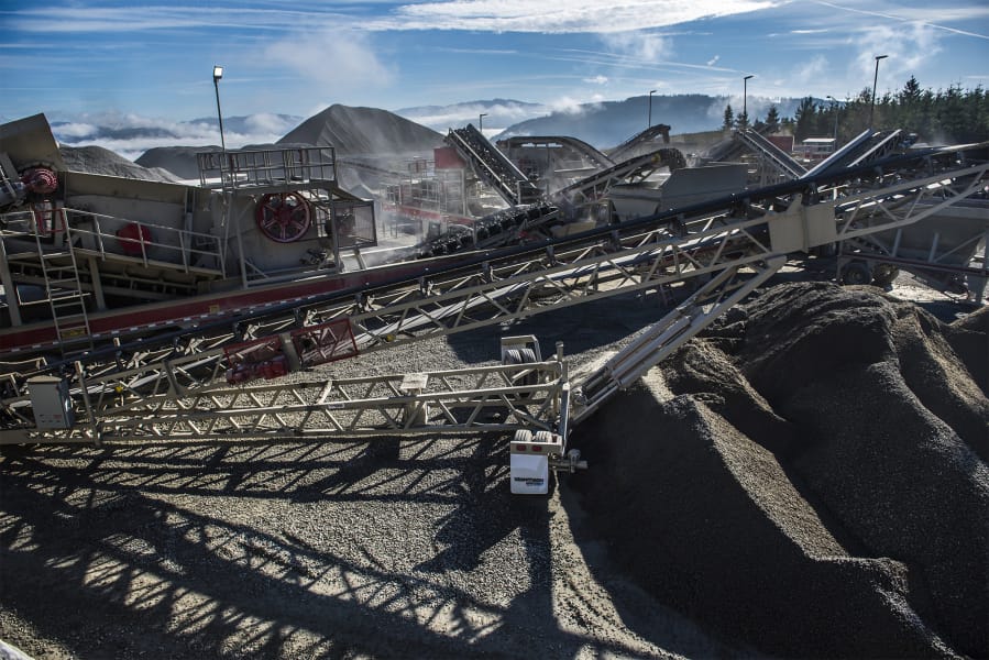 A rock crusher operates at the Yacolt Mountain Quarry. The county council agreed to change an adjacent piece of land’s zoning to allow for storage of dirt from the quarry.