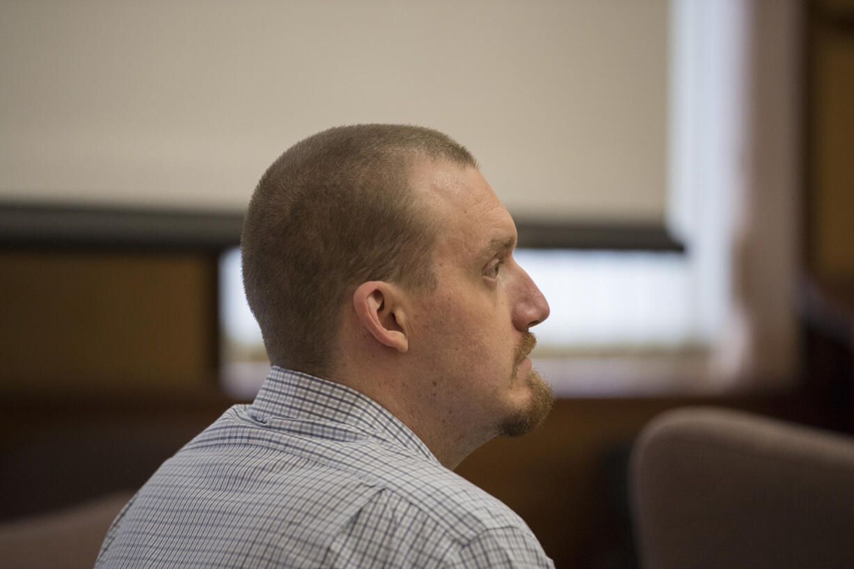 Todd Marjama listens to opening statements in his murder trial. On Tuesday, he testified that the fatal shooting of his estranged wife was accidental.