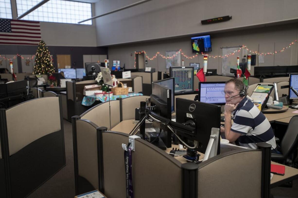 Supervisor John Gaylord listens to a caller while working Thursday afternoon at Clark Regional Emergency Services Agency headquarters in Vancouver. He’s been a dispatcher for nearly 30 years.