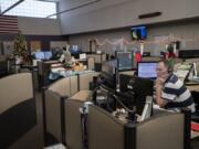 Supervisor John Gaylord listens to a caller while working Thursday afternoon at Clark Regional Emergency Services Agency headquarters in Vancouver. He’s been a dispatcher for nearly 30 years.