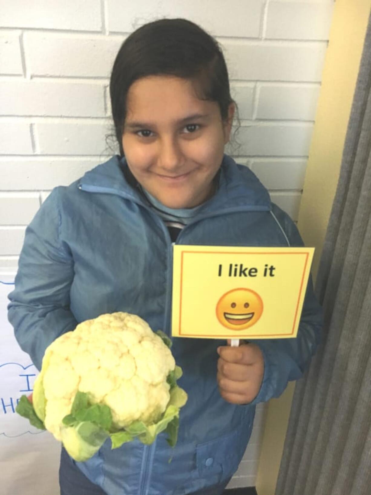 Sifton: Sifton Elementary School student Kimberly Reyes holds cauliflower, the featured ingredient of the month in Evergreen Public Schools’ Harvest of the Month program.