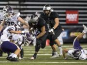 Union's Joseph Siofele (26) runs the ball during the Class 4A state football championship game against Lake Stevens on Saturday, Dec. 1, 2018, in Tacoma, Wash.