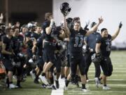 Union celebrates a field goal at the end of the first half during the Class 4A state football championship game against Lake Stevens on Saturday, Dec. 1, 2018, in Tacoma, Wash.