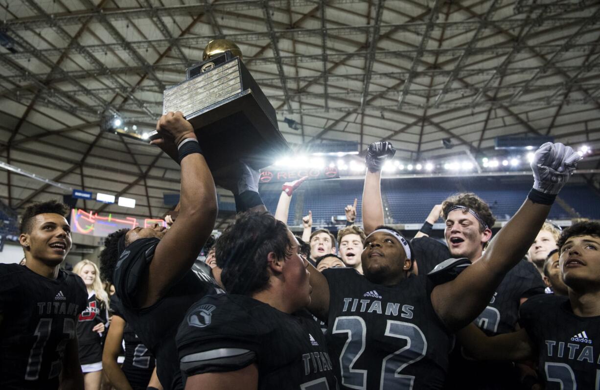 Union celebrates their win over Lake Stevens for the Class 4A state title on Saturday, Dec. 1, 2018, in Tacoma, Wash. The Titans won 52-20.