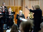 Music director Jana Hart conducts the Vancouver USA Singers during a holiday concert on Dec. 9. The whole group will be back on Dec.