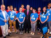 Lake Shore: Columbia River High School’s Symphony Koss, right, with U.S. Ambassador to China Terry Branstad, left, and other musicians from the National Youth Orchestra of United States on their 17-day tour of Asia.