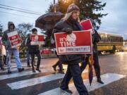 Supporters of the Vancouver Association of Education Support Professionals line the road during a rally in front of the Vancouver Public Schools' offices on Dec. 11.