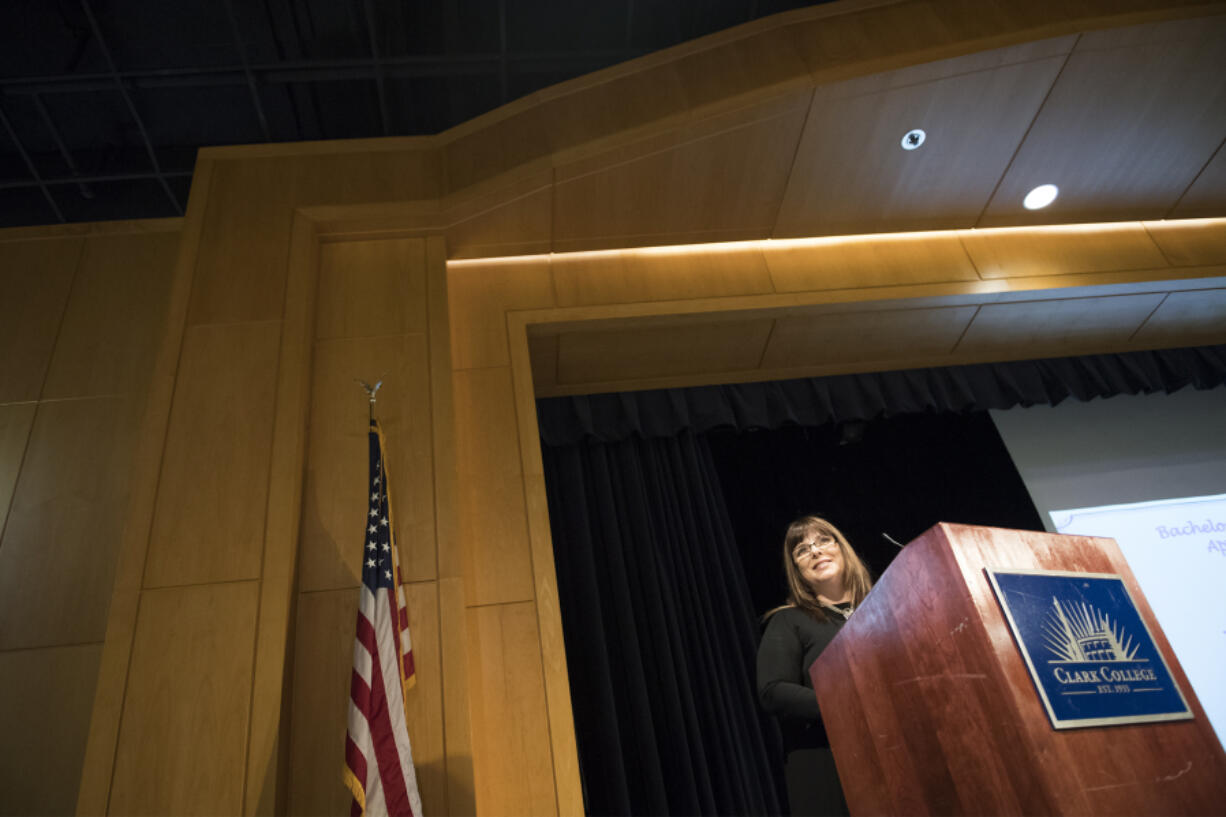 Student speaker Silvia Marinova speaks to the audience during a graduation ceremony for Clark College’s first class of bachelor’s of applied science in applied management degree recipients at Clark College on Tuesday night. Marinova has dreamed of earning a bachelor’s degree since arriving in the United States 20 years ago.