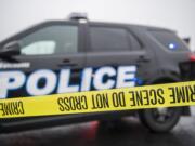 Crime scene tape blocks off the parking lot at Pacific 63 Center during an investigation into a fatal shooting in Hazel Dell on Monday afternoon, Dec. 10, 2018.