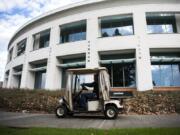 Interim custodial supervisor David Abts drives a campus golf cart to Gaiser Hall at Clark College.