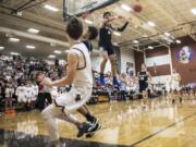 Skyview’s Alex Schumacher blocks a shot by Columbia River’s Nate Snook during Friday’s non-league game at Columbia River High School.