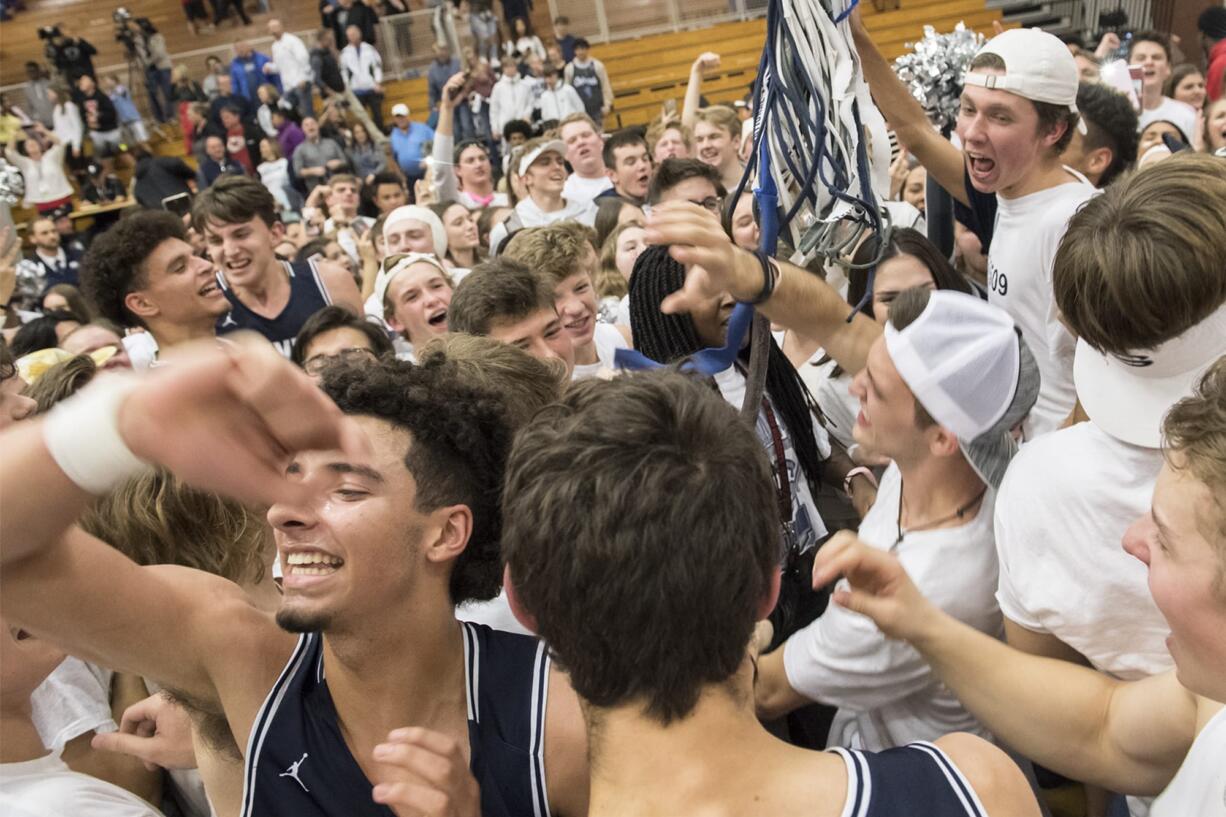 Skyview celebrates their win over Columbia River at Columbia River High School on Friday night, Dec. 14, 2018.