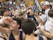 Skyview celebrates their win over Columbia River at Columbia River High School on Friday night, Dec. 14, 2018.