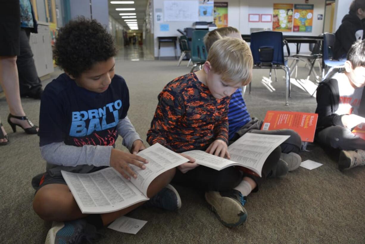 Washougal: Cape Horn-Skye Elementary School third-graders Reece Rogers, left, and Gideon Kestner receive dictionaries from the Camas-Washougal Rotary Club.