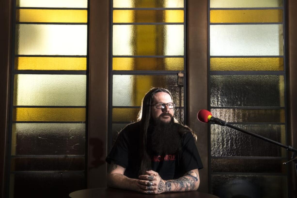 Brian Houghton, host of “The Horror Aisle” podcast, poses for a press photo at Kiggins Theatre on Dec. 20. Below, right: “Silent Night, Deadly Night” shows tonight at the Kiggins Theatre.