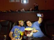 Sean Nance, left, and Eli Schwartz, who both run the podcast “All Aboard The Hype Train,” take a photo during a viewing of “Bumblebee,” the newest film in the Transformer’s franchise, at Vancouver’s Cinetopia Cinema.