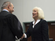 Eileen Quiring thanks Clark County District Court Judge Darvin J. Zimmerman after being sworn in Thursday as the new chair of the Clark County Council.