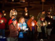 Vancouver Mayor Anne McEnerny-Ogle stands with others during a vigil for the homeless Friday night at St. Paul Lutheran Church in downtown Vancouver.