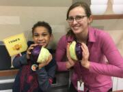 Hearthwood: Eyo Colbert, left, and Nicole Nissen Hooper at Hearthwood Elementary School, which hosted this month’s Harvest of the Month program. The featured local ingredient was cabbage.