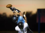 Hockinson's Sawyer Racanelli (11) narrowly misses a catch  during Friday night's game in Hockinson, Wash., on Sept. 28, 2018.