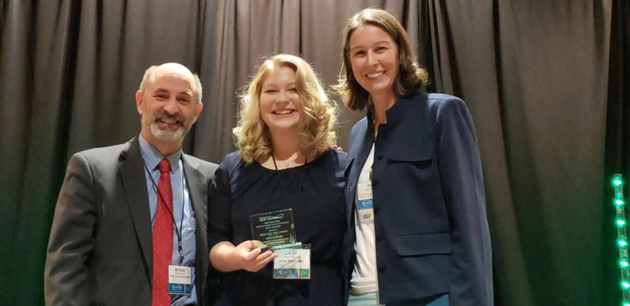 Washougal: Washougal High School Senior Chloe Connors accepting the 2018 Washington State Exemplary Substance Abuse Prevention Award for Youth Leadership with Michael Langer, behavioral health and prevention chief for the Washington State Division of Behavioral Health and Recovery, and Sarah Mariani, supervisor for the Washington State Health Care Authority.