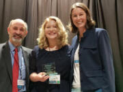 Washougal: Washougal High School Senior Chloe Connors accepting the 2018 Washington State Exemplary Substance Abuse Prevention Award for Youth Leadership with Michael Langer, behavioral health and prevention chief for the Washington State Division of Behavioral Health and Recovery, and Sarah Mariani, supervisor for the Washington State Health Care Authority.