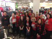 Central Vancouver: Staff members from J.C. Penney along with Rotary Club of Vancouver President Jennifer Miltenberger, right front row, in plaid vest, assisted kids shopping for winter clothes as part of the fifth annual Santa Clothes program, organized by the Vancouver club and Rotary Club of Greater Clark County.