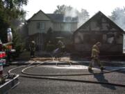 Vancouver Fire Department and Clark County Fire District 6 work a July fire at 11906 N.E. 40th Ave. in Vancouver.