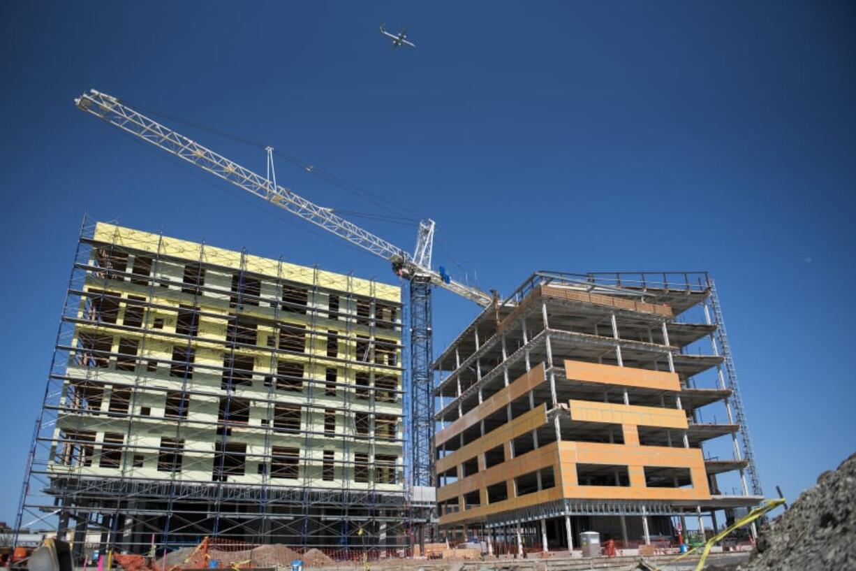 The Murdock and Rediviva buildings at The Waterfront Vancouver shared a single crane that stayed just below the restricted airspace. The plane in the picture is bound for Portland International Airport. Planes headed for Pearson Field at the Vancouver National Historic Site fly at lower altitudes.