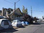 Tents and other make-shift shelters are seen here in front of Share. The new Human Service Facilities Siting ordinance will make it easier for Share to locate additional services in the future.