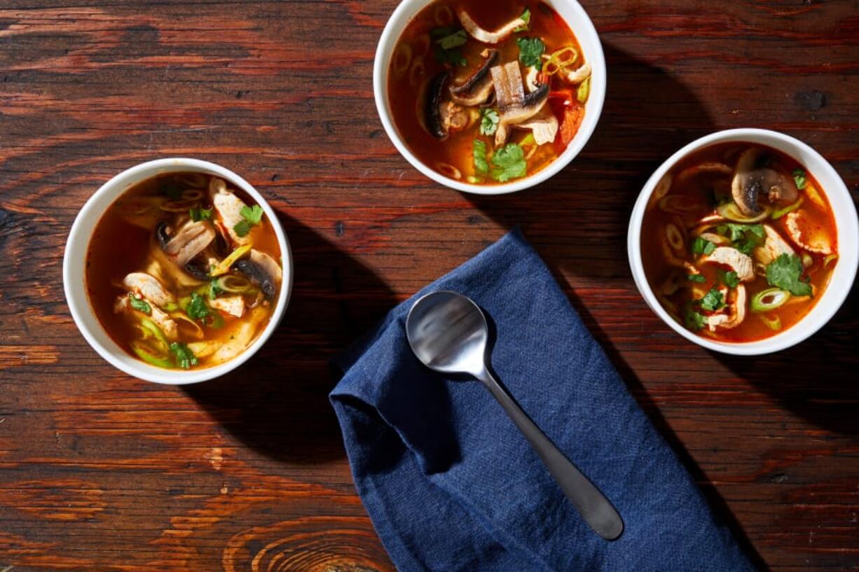 Spicy Lemon Grass Soup (Tom Yum Gai).(Stacy Zarin Goldberg for The Washington Post)