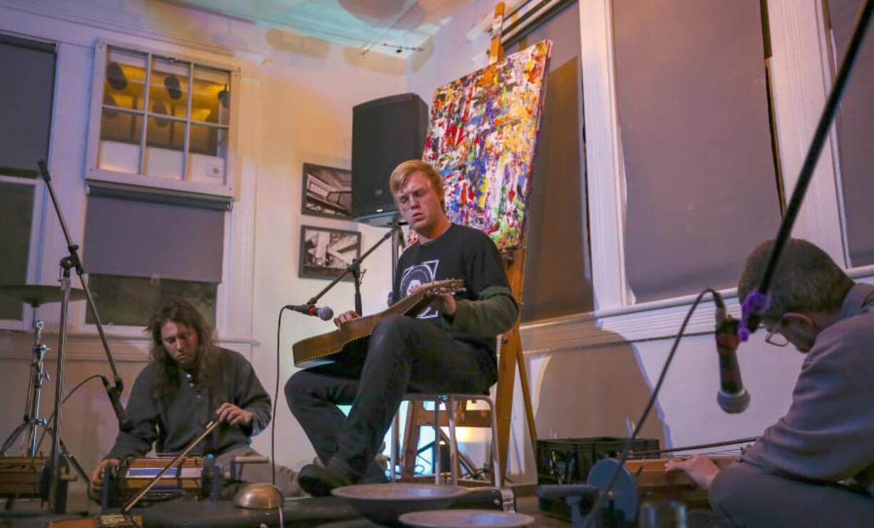 Daniel Bachman, center, performs alongside fellow artists Forrest Marquisee, left, and Ian McColm.