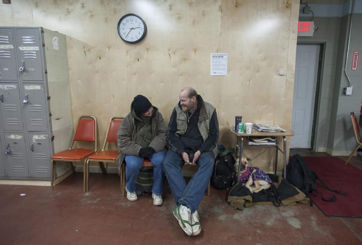 Michael Fugger, right, was among the homeless people who died this year. He’s pictured with Heather Gallardo, left, and their dog Chubbs on March 9, 2016, at the former day center in west Vancouver.
