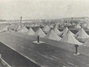 In 1918, Spruce Mill Division soldiers lived in tents such as these. In an era when newfangled airplanes were made of wood and fabric, Vancouver was an aircraft manufacturing hub.