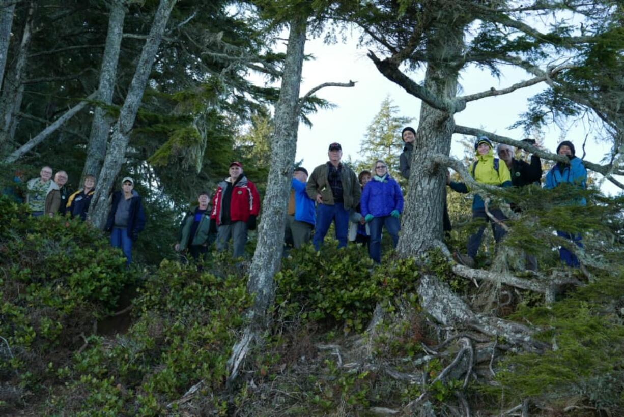 First Day hikers at Cape Disappointment State Park gather for a group photo on New Year’s Day 2018. The park will once again host an interpretive hike on Jan. 1 along the Lighthouse Keepers Loop Trail.