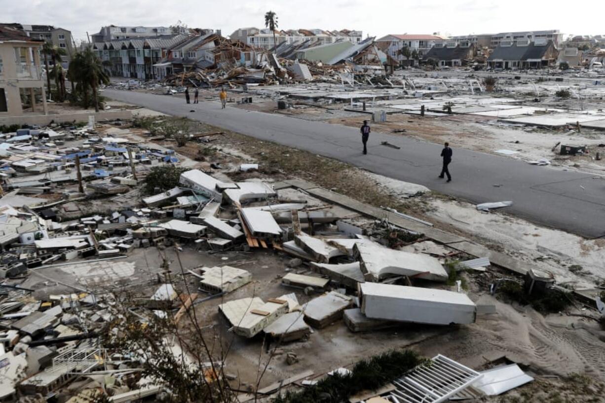 Rescue personnel search through debris in the aftermath of Hurricane Michael in Mexico Beach, Fla., on Oct. 11, 2018.