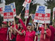 Teachers and supporters from Summit View High School and the Center for Agriculture, Science and Environmental Education, or CASEE, greet motorists as they picket along Lewisville Highway on Aug. 30.