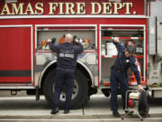 Camas-Washougal Fire Department personnel go through a routine inspection of equipment at Camas Fire Station 41.